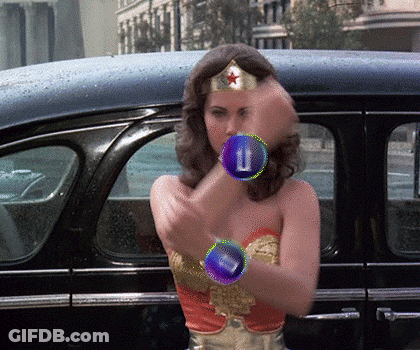 Wonder Woman Costume Standing In Front Of Car With Letter U On Arm GIF