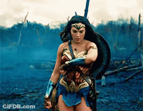 Wonder Woman Holding Sword And Shield In Field GIF
