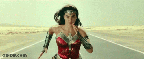 Wonder Woman Running Down Desert Road Holding Sword GIF