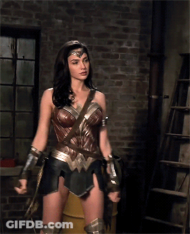Wonder Woman Standing In Front Of Brick Wall GIF