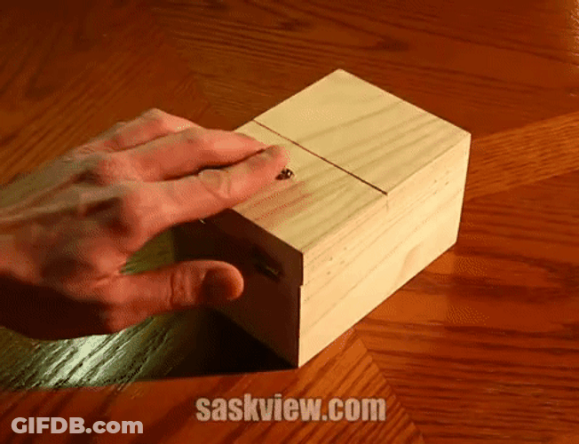 Wooden Box With Robotic Hands GIF