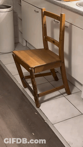 Wooden Chair On Tiled Kitchen Floor GIF