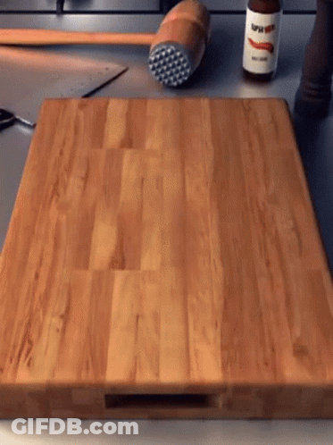 Wooden Cutting Board With Super Hot Sauce Bottle GIF