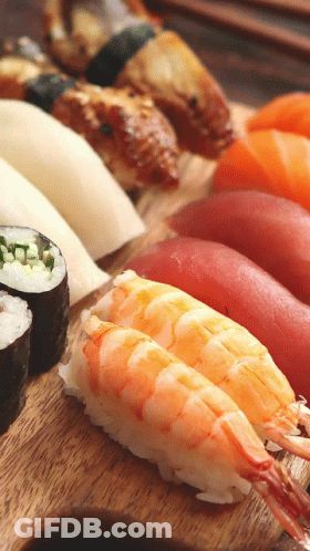 Wooden Cutting Board With Sushi GIF