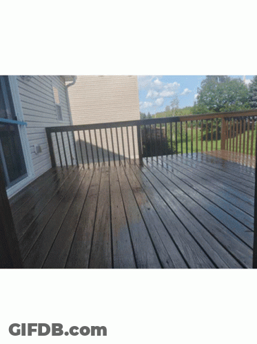 Wooden Deck With Railing And White House GIF