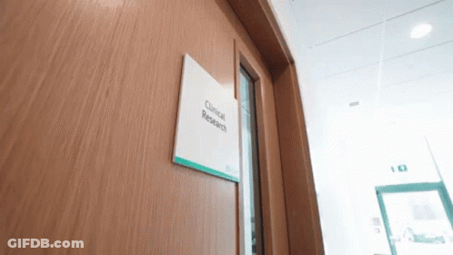 Wooden Door With Clinical Research Sign GIF