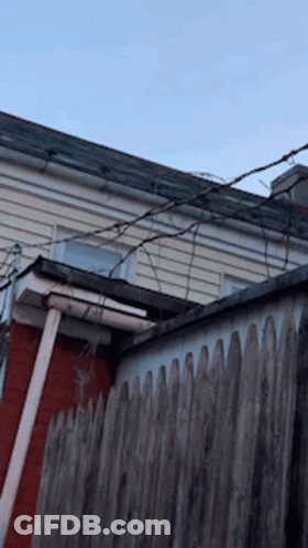 Wooden Fence In Front Of House With Roof GIF