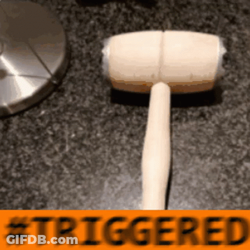 Wooden Hammer Next To Triggered Sign GIF