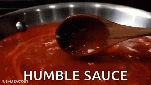 Wooden Spoon Dipped In Pot Of Sauce GIF