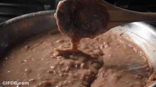 Wooden Spoon Stirring Brown Liquid GIF
