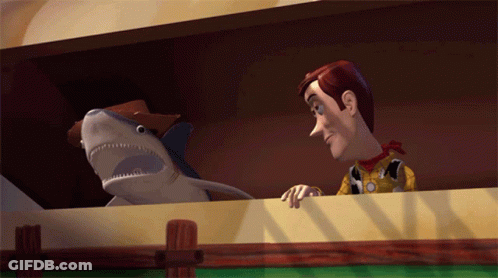Woody And A Stuffed Shark From Toy Story GIF