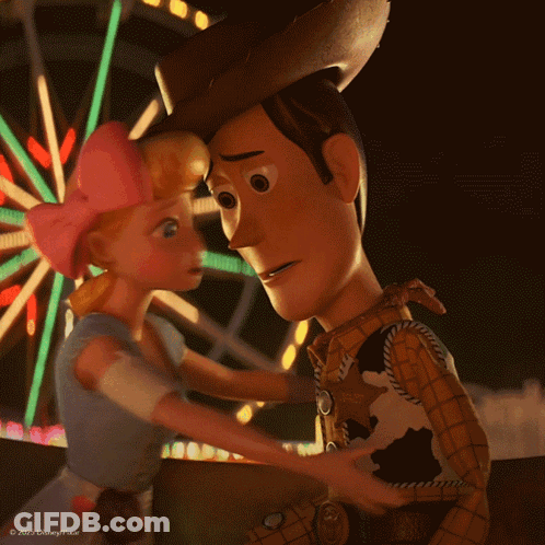 Woody And Bo Peep From Toy Story Are Hugging In Front Of A Ferris Wheel GIF
