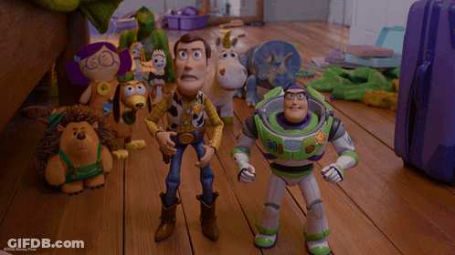 Woody And Buzz Lightyear Are Standing Next To Each Other In A Scene From Toy Story GIF