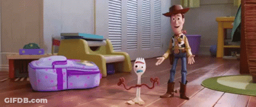 Woody And Forky From Toy Story 4 Are Standing Next To Each Other GIF