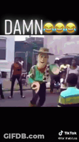 Woody Doll Dancing In Street Before Crowd GIF