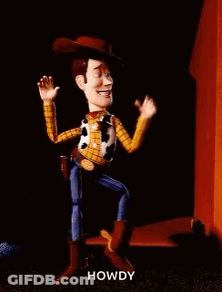 Woody From Toy Story Is Dancing In Front Of A Red Building . GIF