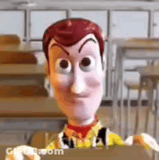 Woody From Toy Story Is Holding A Piece Of Cardboard In A Classroom . GIF