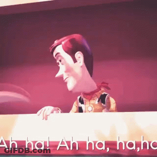 Woody From Toy Story Is Laughing While Looking Over A Table GIF