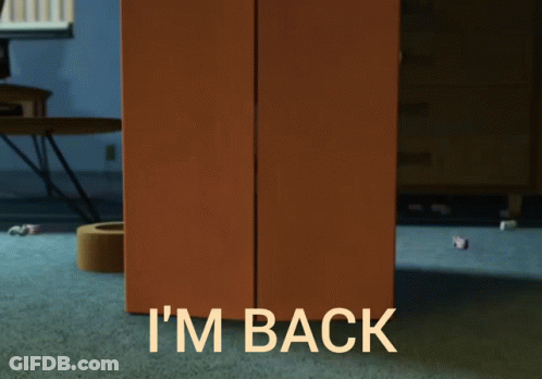Woody From Toy Story Is Peeking Out From Behind A Cardboard Box That Says I 'M Back GIF