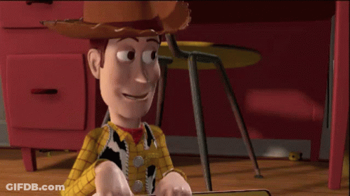 Woody From Toy Story Is Sitting On A Wooden Floor GIF