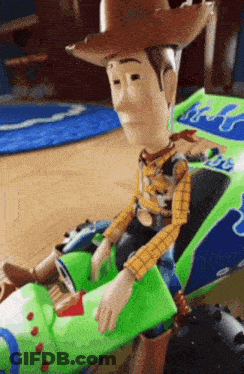 Woody From Toy Story Is Sitting On Buzz Lightyear 'S Toy Car GIF