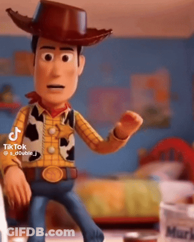 Woody From Toy Story Is Wearing A Cowboy Hat And Standing In A Room . GIF