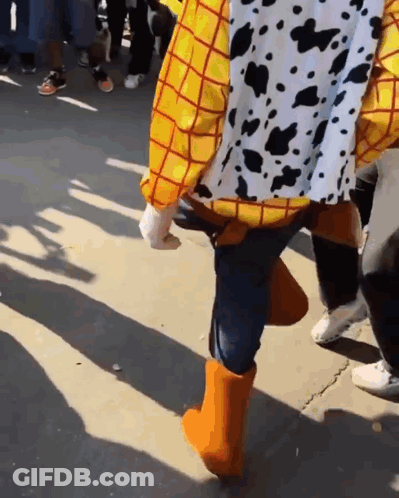 Woody From Toy Story Walking Down Street GIF