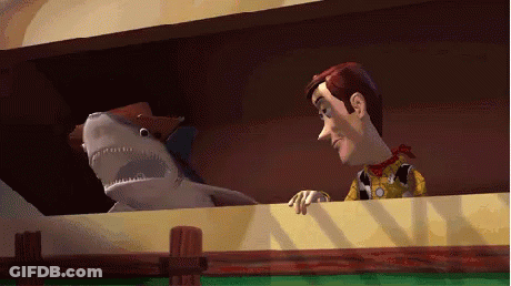 Woody Toy Story Talking To Stuffed Animal Shark GIF