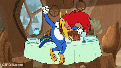 Woody Woodpecker Sitting At Table With Cake And Wine Glasses GIF