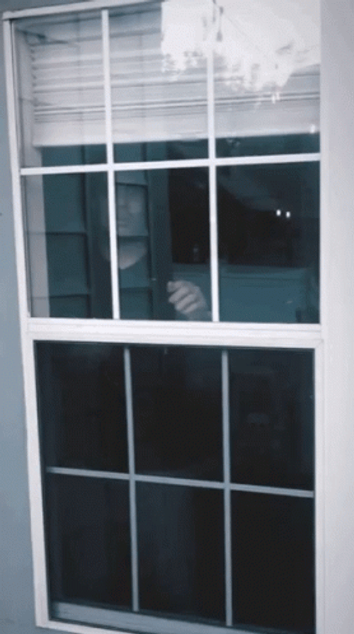 Worried Man Looking Out The Window GIF