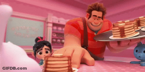 Wreck It Ralph Is Holding A Tray Of Pancakes And A Stack Of Pancakes On A Table . GIF
