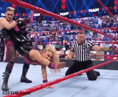 Wrestler Being Lifted By Another Wrestler In Ring GIF