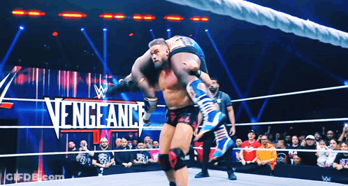 Wrestler Carrying Another In Vengeance Match GIF