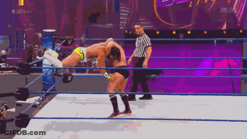 Wrestler Carrying Another On Shoulders In Ring GIF