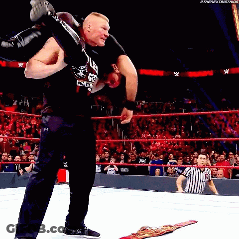 Wrestler Carrying Another Wrestler On Shoulders In Ring GIF