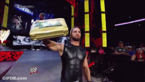 Wrestler Carrying Suitcase On Head GIF