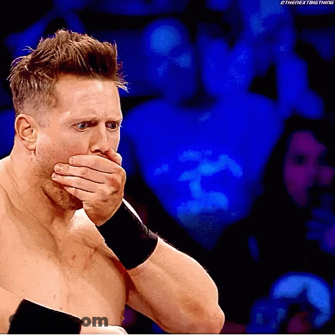 Wrestler Covering Mouth During Match GIF