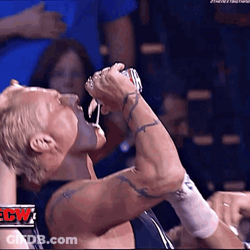 Wrestler Drinking From Can Before Crowd GIF