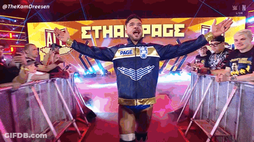 Wrestler Ethan Page Arms Outstretched Before Crowd GIF