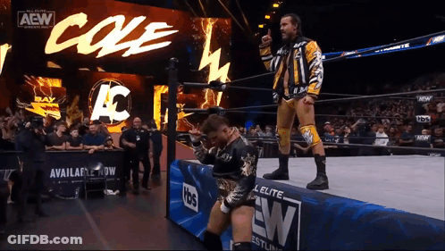 Wrestler Giving Thumbs Up In Front Of AEW Banner GIF