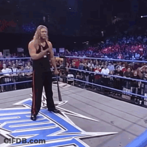 Wrestler Holding Baseball Bat In Ring GIF