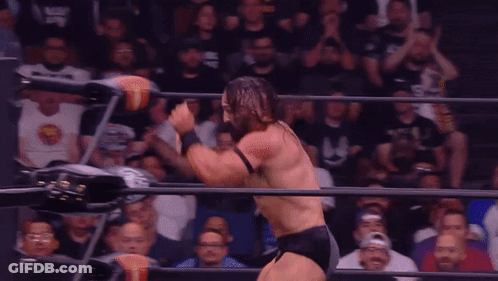 Wrestler Holding Belt In Ring GIF