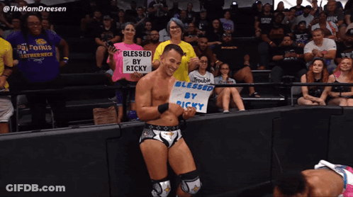 Wrestler Holding Blessed Sign GIF