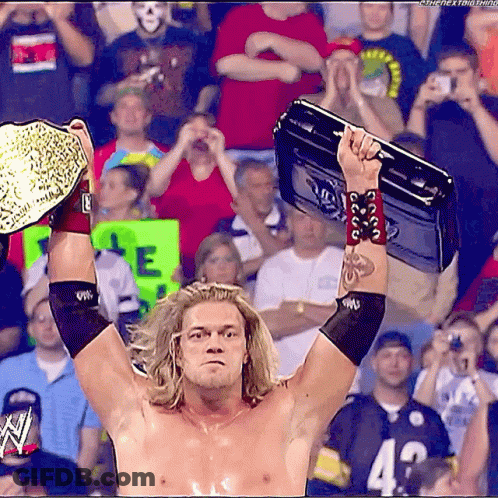 Wrestler Holding Briefcase Over Head GIF