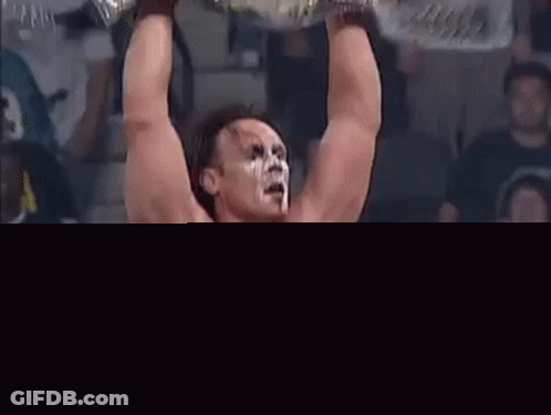 Wrestler Holding Championship Belt GIF
