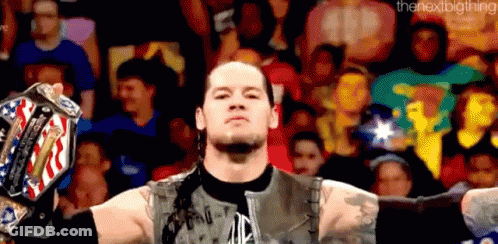 Wrestler Holding Championship Belt Before Crowd GIF