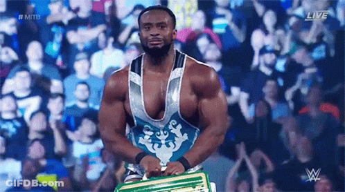 Wrestler Holding Championship Belt In Front Of Crowd GIF