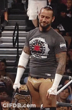Wrestler Holding Championship Belt GIF