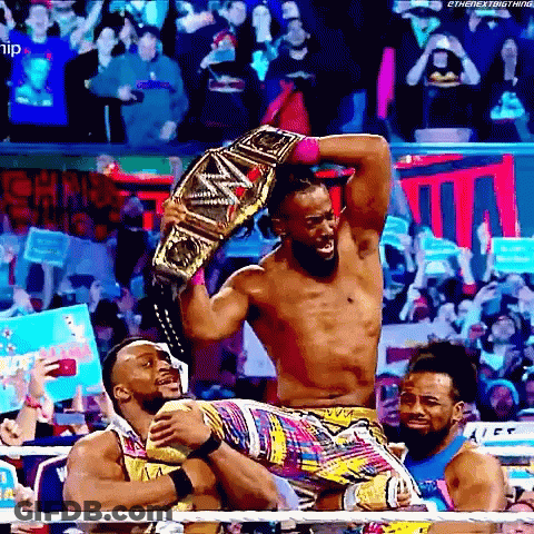 Wrestler Holding Championship Belt GIF