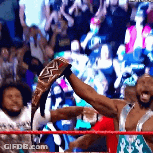 Wrestler Holding Championship Belt GIF